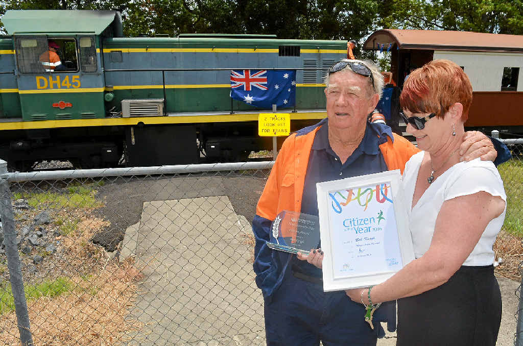 COMMITTED: Robert Keogh accepts his award from daughter Julia, who attended the ceremony in his absence.